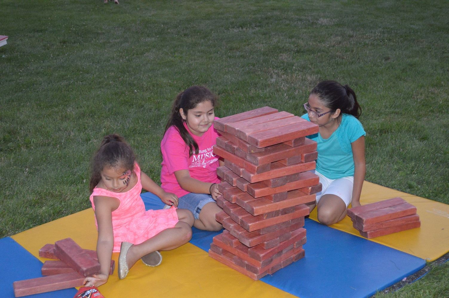 Children play life-sized Jenga at Villa Park's National Night Out event at the Iowa Community Center Aug. 2, 2016.